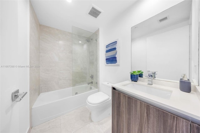 full bathroom with vanity, tiled shower / bath combo, toilet, and tile patterned flooring