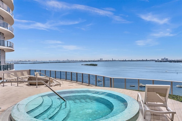 view of pool featuring a water view