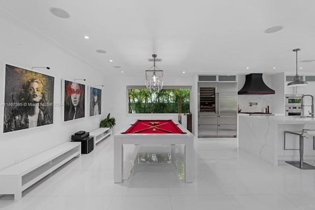 rec room with an inviting chandelier, pool table, and light tile patterned floors