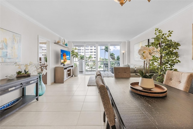 tiled dining space featuring ornamental molding