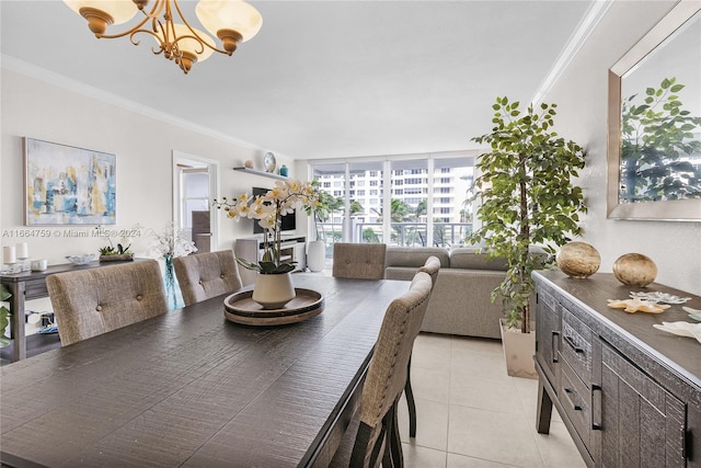 tiled dining area featuring crown molding and an inviting chandelier