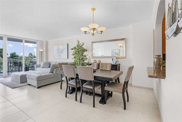 tiled dining room with a notable chandelier and crown molding