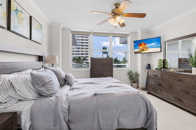 tiled bedroom featuring ceiling fan and crown molding