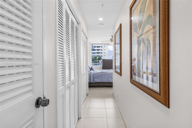 hall with light tile patterned floors