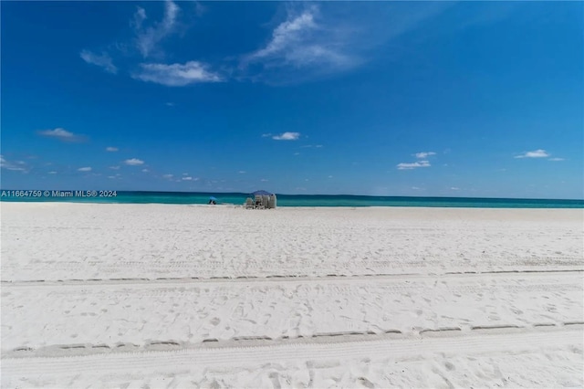 property view of water featuring a beach view