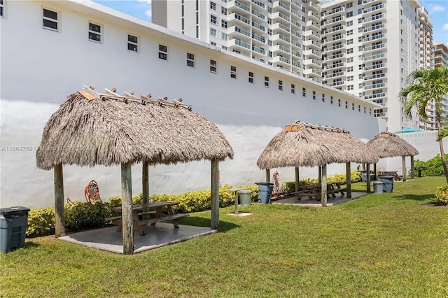 view of home's community with a lawn and a gazebo