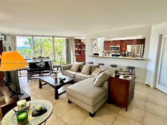 living room featuring light tile patterned flooring