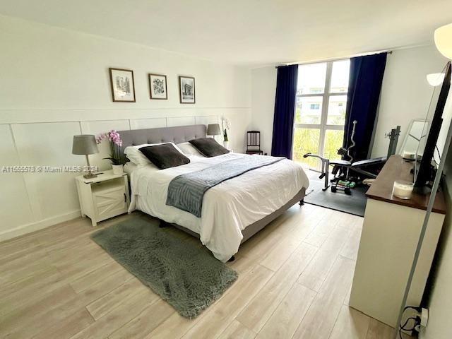 bedroom with light hardwood / wood-style floors