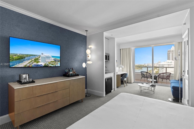 carpeted bedroom featuring ornamental molding and a water view