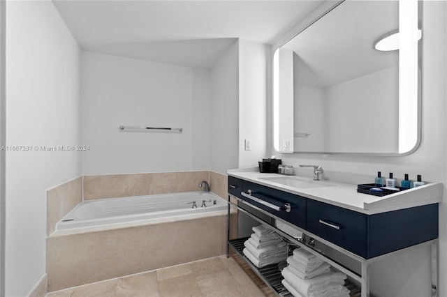 bathroom featuring vanity and a washtub