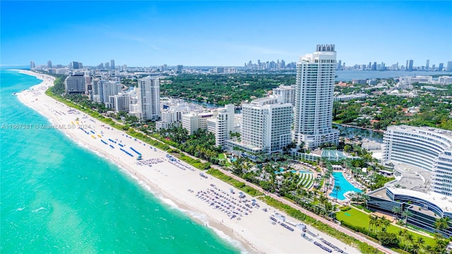 birds eye view of property featuring a view of the beach and a water view