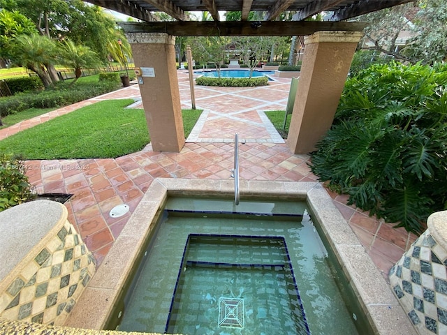 view of patio / terrace with a pergola and a community pool