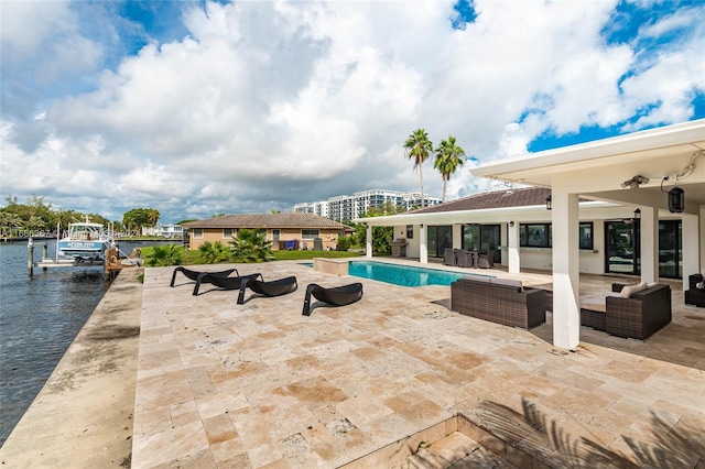 view of pool featuring a dock, a water view, a patio area, and an outdoor hangout area