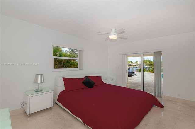 bedroom featuring light tile patterned flooring, ceiling fan, and access to exterior