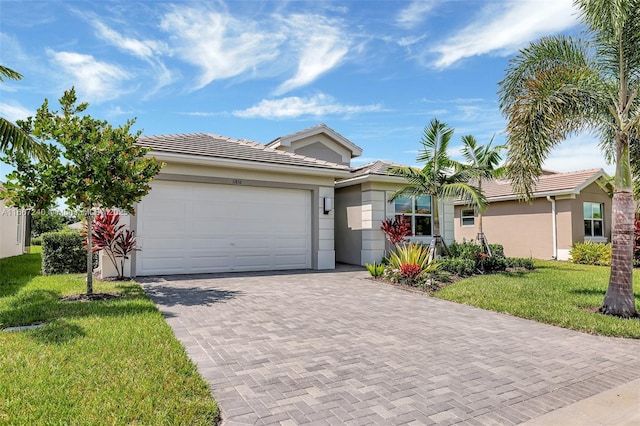 view of front of home featuring a garage and a front yard