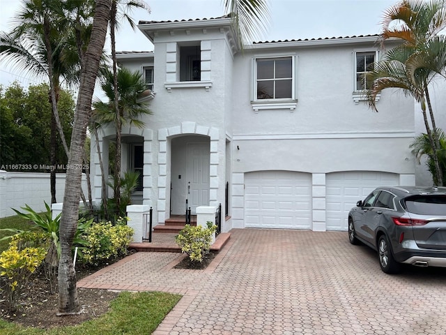 mediterranean / spanish-style home featuring a garage