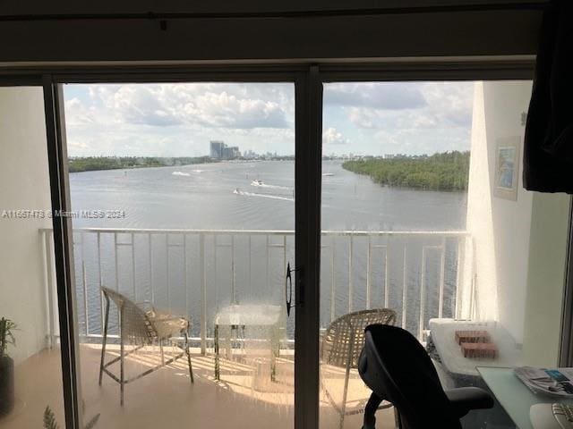 balcony featuring a water view