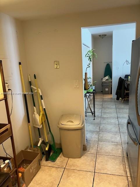 hallway with light tile patterned flooring