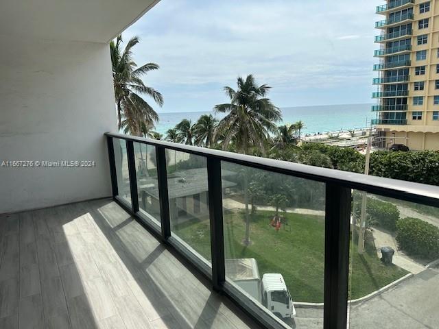 balcony featuring a water view