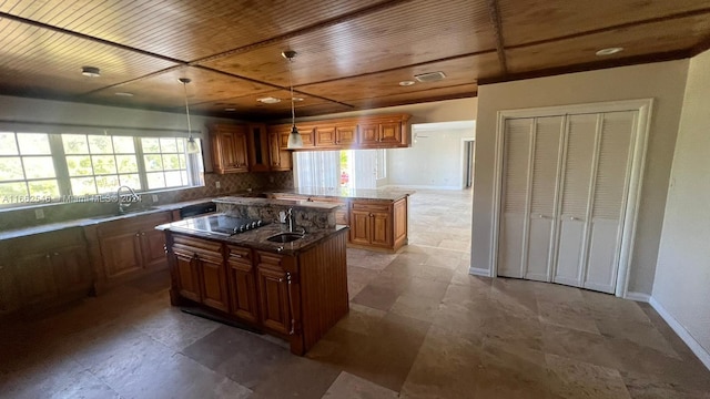 kitchen with wood ceiling, a center island, sink, backsplash, and decorative light fixtures