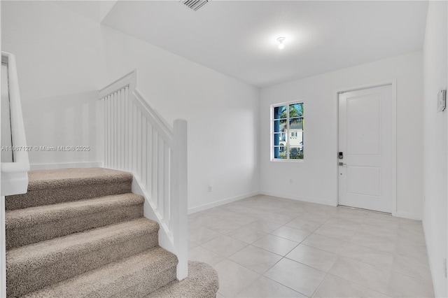 foyer with light tile patterned floors