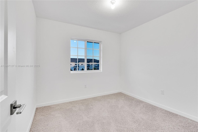 unfurnished room featuring carpet flooring