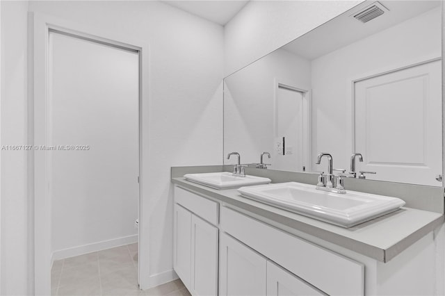 bathroom with vanity and tile patterned floors