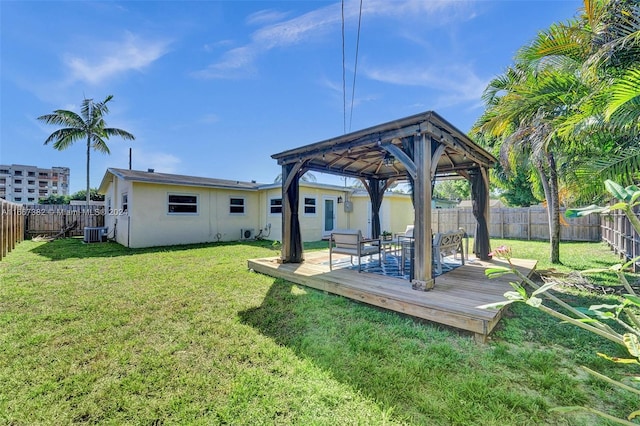 view of yard with a gazebo, central AC unit, and a wooden deck