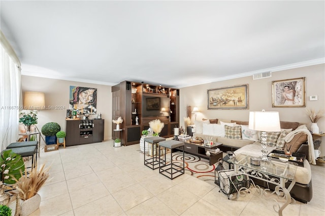 living room with light tile patterned floors and crown molding