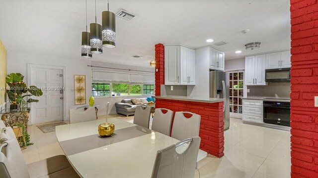 dining space with light tile patterned floors, recessed lighting, a chandelier, and visible vents