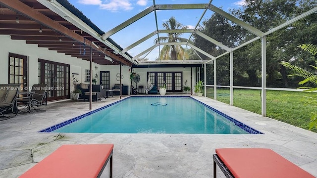 outdoor pool featuring a patio area, french doors, and glass enclosure