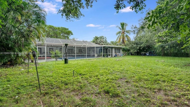 view of yard with a lanai