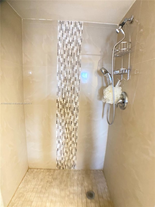 bathroom with a tile shower