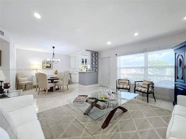 living room with light tile patterned floors and a notable chandelier