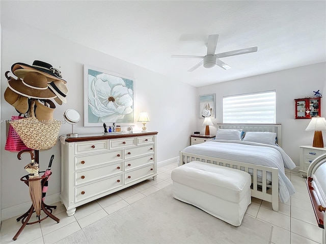 tiled bedroom featuring ceiling fan