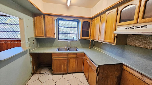 3230 N 23rd Ave, Hollywood, FL 33020 - kitchen featuring a sink, light countertops, plenty of natural light, and under cabinet range hood