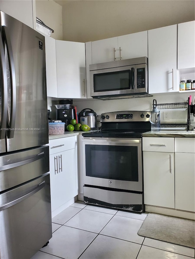 kitchen with white cabinetry and stainless steel appliances