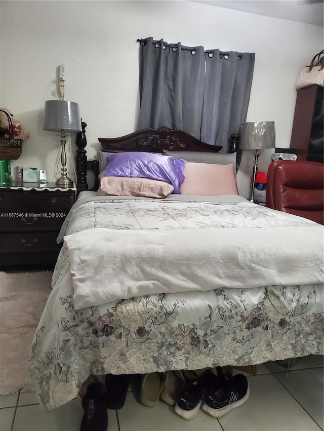 bedroom with tile patterned floors