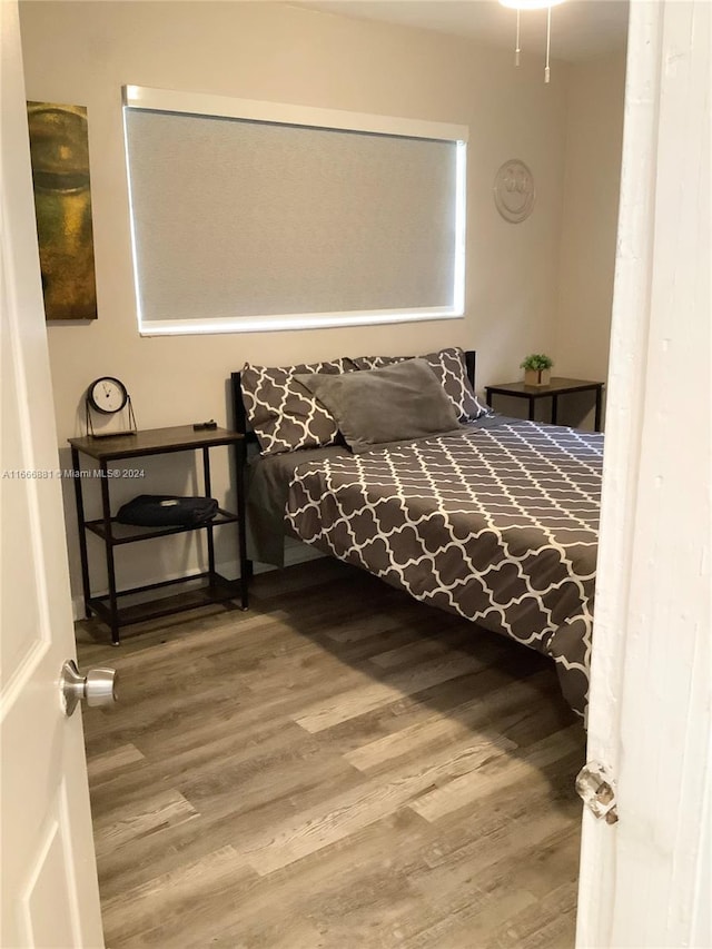 bedroom featuring hardwood / wood-style flooring