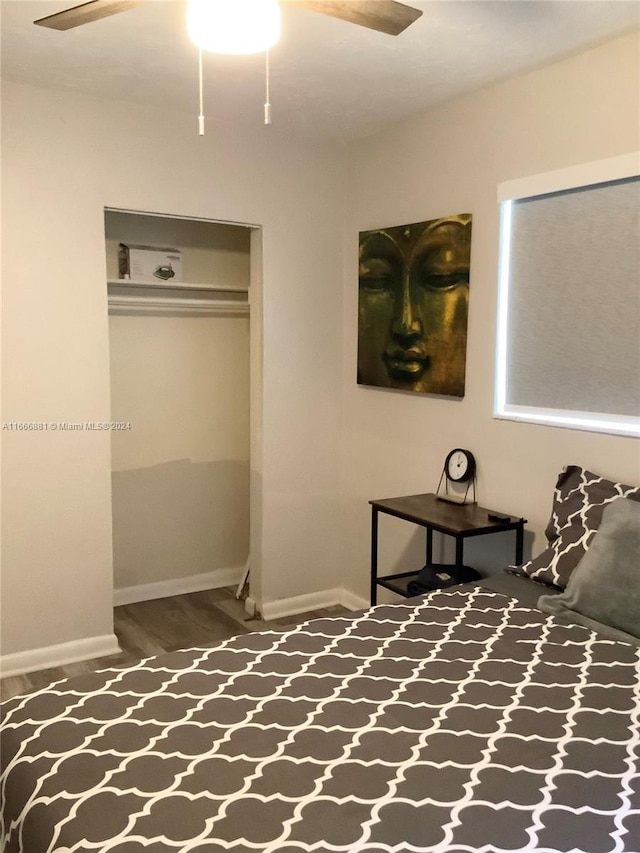 bedroom with a closet, ceiling fan, and hardwood / wood-style flooring