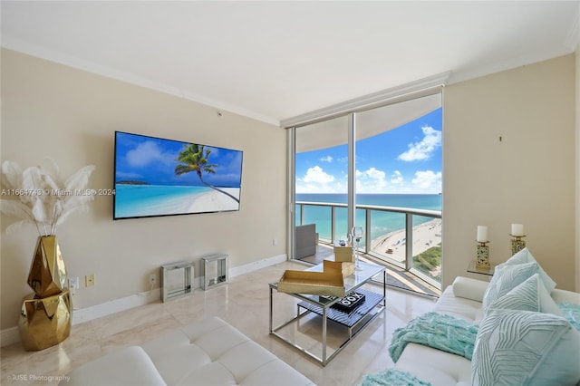 tiled living room featuring expansive windows, baseboards, and crown molding