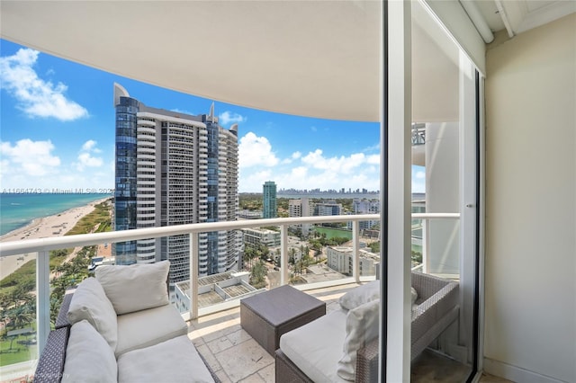 balcony with a water view and a view of city