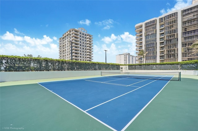 view of sport court with fence