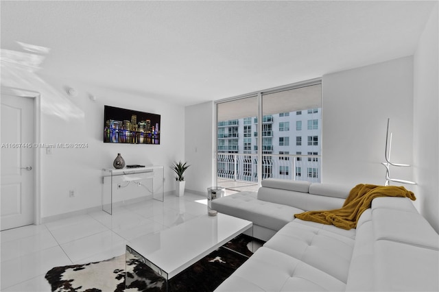 tiled living room with floor to ceiling windows