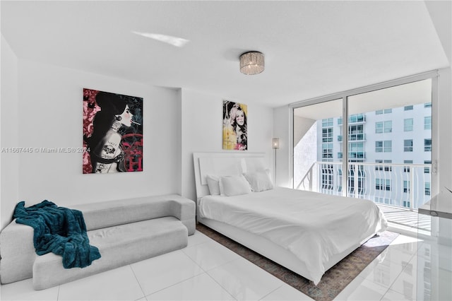 bedroom featuring floor to ceiling windows