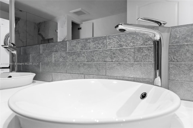 bathroom with tile walls