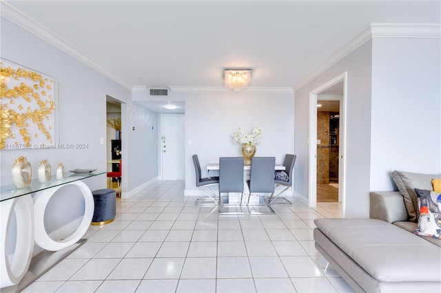 tiled dining space featuring crown molding