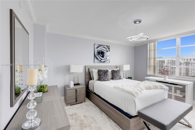 bedroom with an inviting chandelier and ornamental molding