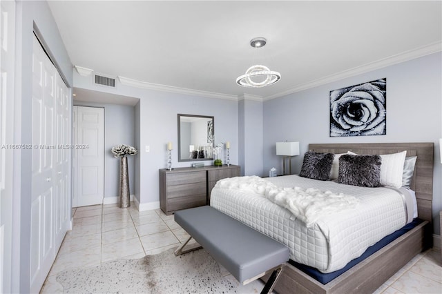 bedroom with crown molding, a closet, and a notable chandelier