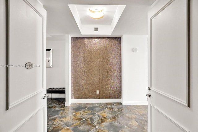 bathroom featuring a raised ceiling